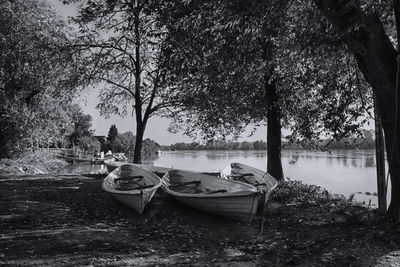 Boats moored on lake