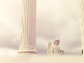 Low angle view of statue against sky