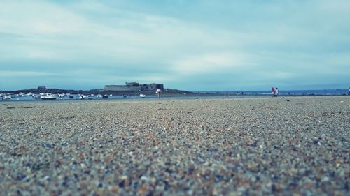 Surface level of beach against sky