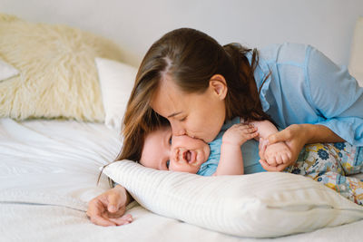 Portrait of a happy mother and child. a young mother is play with little baby boy