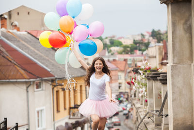 Woman holding balloons