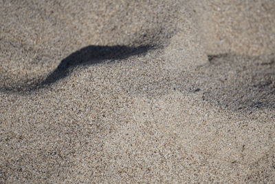 High angle view of shadow on sand