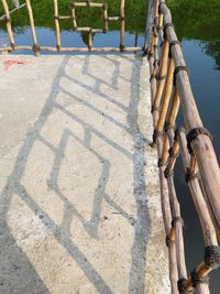 High angle view of tree shadow on water