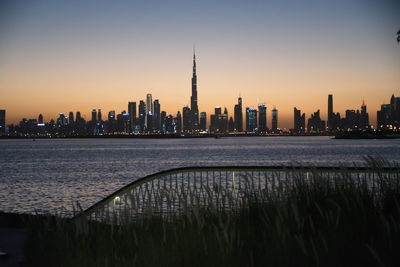 Modern buildings in city at sunset