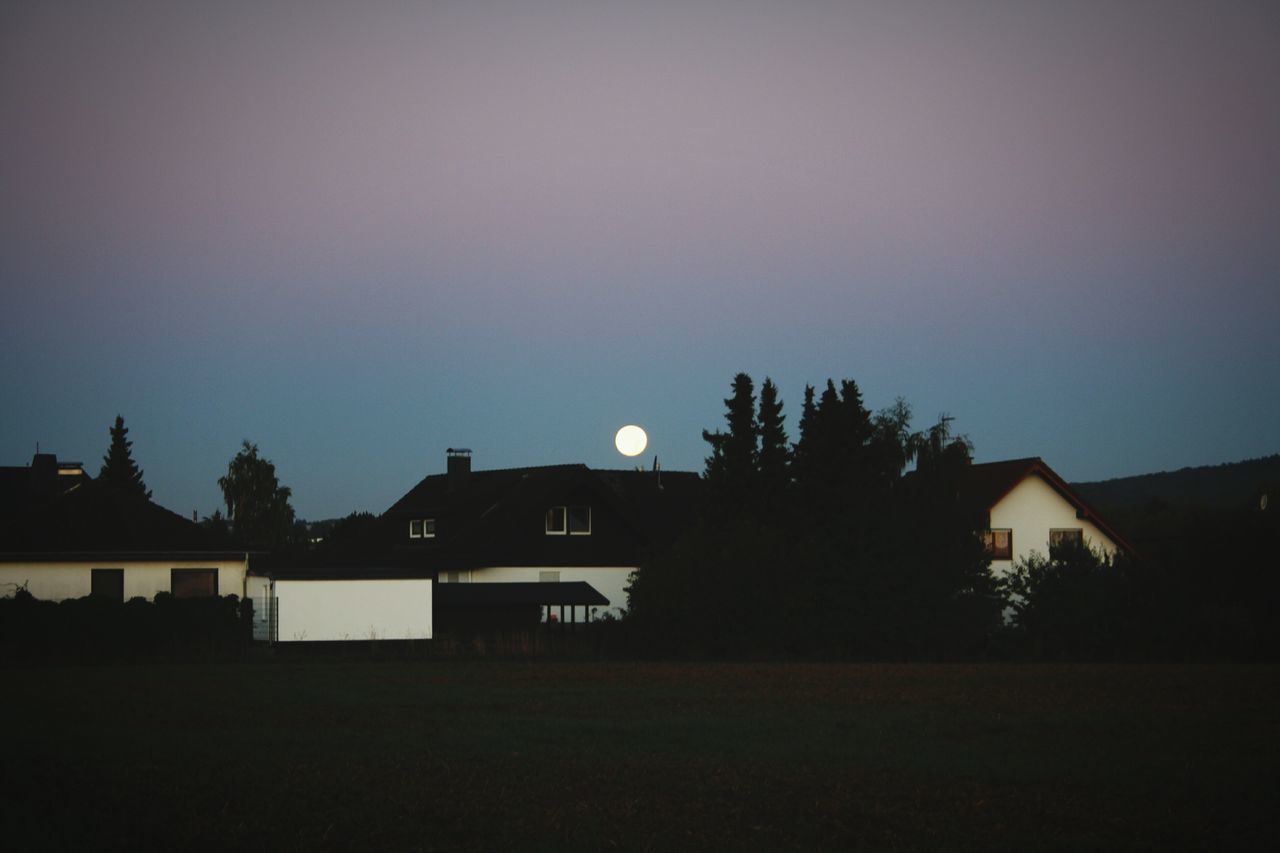 architecture, building exterior, built structure, silhouette, tree, house, sky, sunset, copy space, dusk, residential structure, clear sky, tranquility, landscape, tranquil scene, nature, scenics, beauty in nature, dark, outdoors