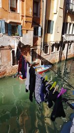 Clothes drying on canal by residential buildings