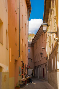 Narrow street amidst buildings in town