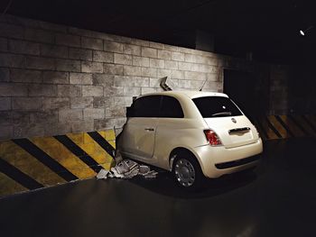 Vintage car on street against wall