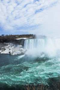 View of waterfall against sky