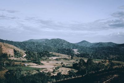 Scenic view of landscape and mountains against sky