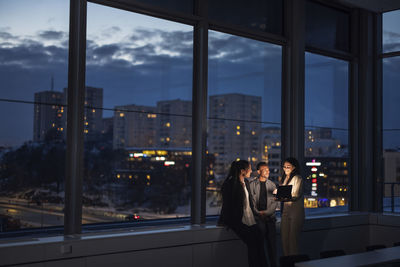 Business people working late in office