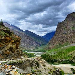 Scenic view of mountains against cloudy sky