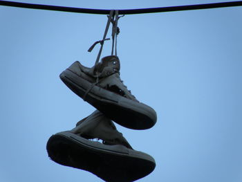 Low angle view of statue against clear blue sky