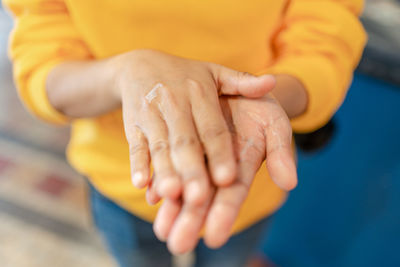 Close-up of woman holding hands