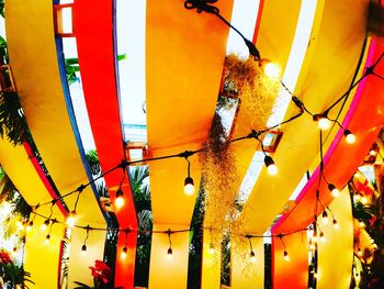 Low angle view of yellow hanging outdoors