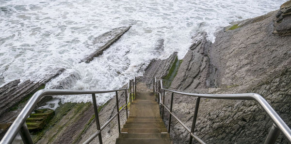 High angle view of steps by sea