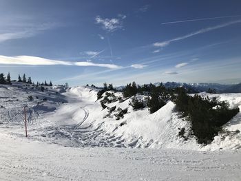 Scenic view of snowcapped mountains against sky