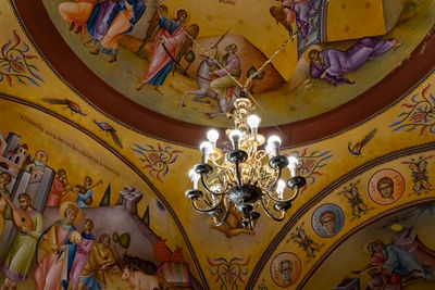 Low angle view of illuminated chandelier