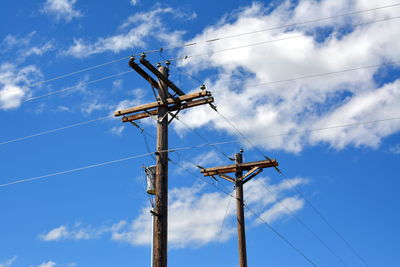 Low section of electric poles against sky