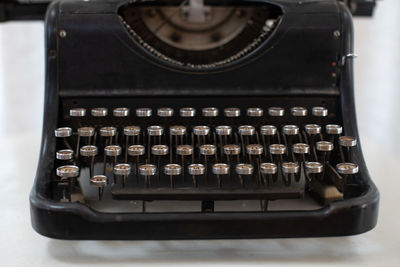 Black typewriter with the russian alphabet. vintage device for typing.  typing machine. keys close u