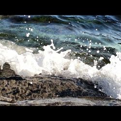 Waves splashing on rocks