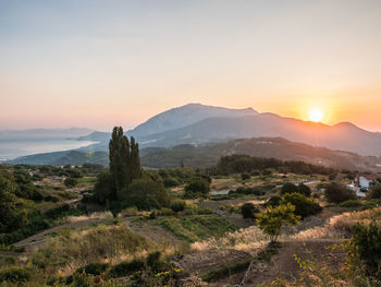 Scenic view of mountains against sky during sunset