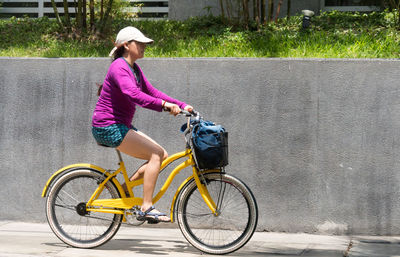 Man riding bicycle on road