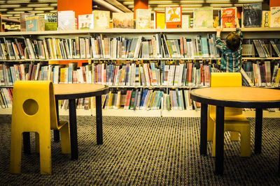 Empty chairs and tables in library