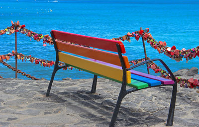 Chairs on beach by swimming pool