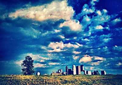 Scenic view of landscape against cloudy sky