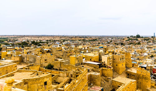 High angle view of buildings in city against sky