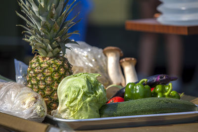 Close-up of various vegetables and fruits in tray on table