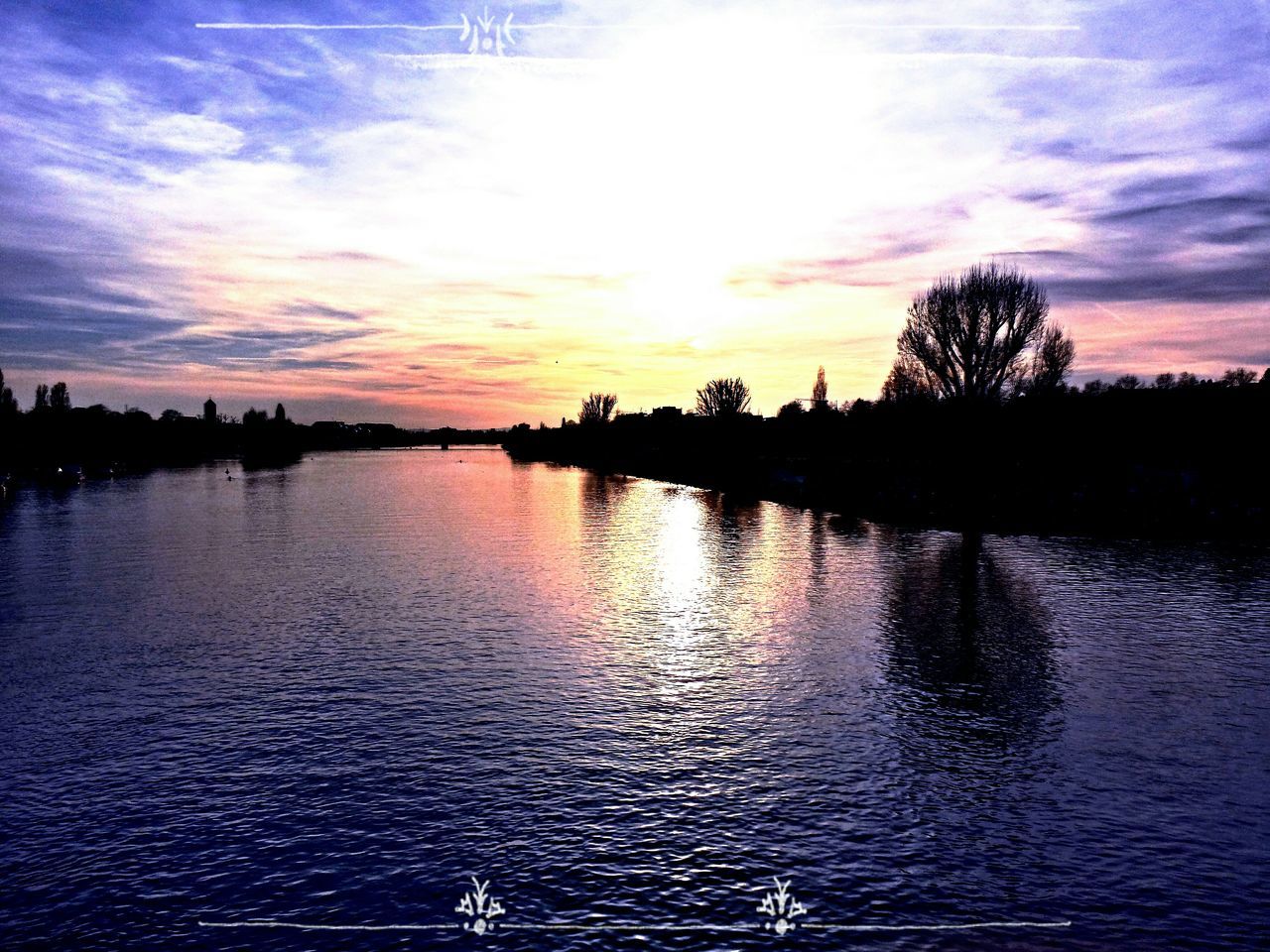 sunset, water, silhouette, sky, tranquil scene, scenics, tranquility, reflection, beauty in nature, waterfront, cloud - sky, rippled, lake, nature, idyllic, cloud, tree, dusk, river, orange color