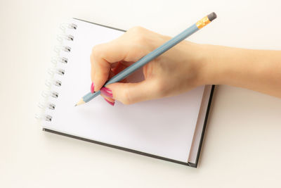 Close-up of woman hand holding book