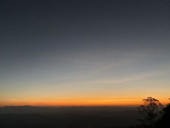 Scenic view of silhouette landscape against sky during sunset