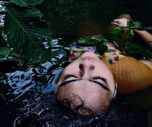 Close-up portrait of young woman sleeping