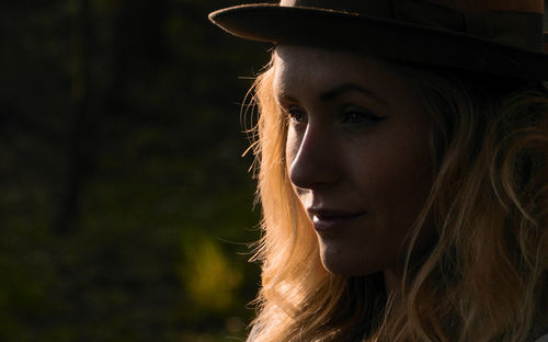 Beautiful young woman smiling while looking away