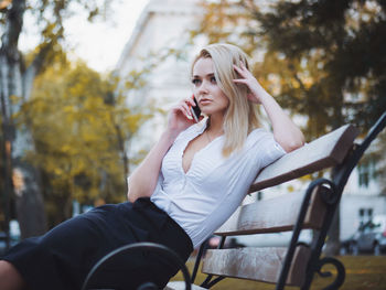 Young woman sitting outdoors