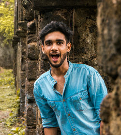 Portrait of young man standing outdoors