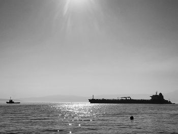 Silhouette of boat in sea