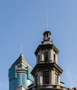 Low angle view of building against blue sky