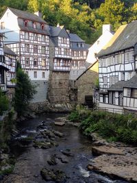 View of old building by river in city