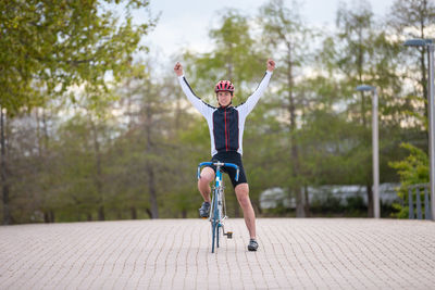 Full length of boy riding bicycle