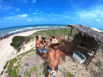 High angle view of people at beach against sky