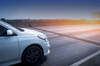 Car on road against clear sky