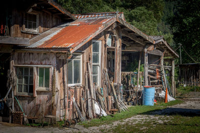 Old abandoned house by building