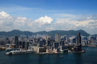 Panoramic view of sea and buildings against sky