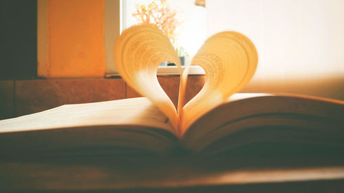 Close-up of book on table at home