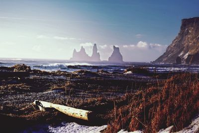 Panoramic view of sea and rocks against sky