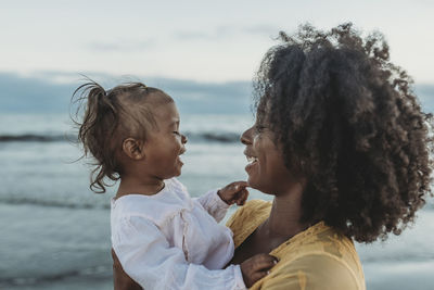 Portrait of mother and son in water